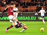 AC Milan's Brazilian forward Kaka kicks and scores during the Serie A football match between AC Milan and Genoa at San Siro Stadium in Milan on November 23, 2013