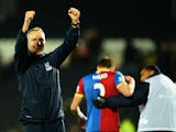 Keith Millen, caretaker manager of Crystal Palace celebrates victory after the Barclays Premier League match between Hull City and Crystal Palace at KC Stadium on November 23, 2013