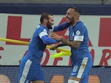 Greece's Konstantinos Mitroglou celebrates after scoring the opening goal against Romania during their World Cup play-off match on November 19, 2013