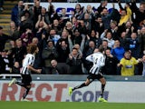 Loic Remy of Newcastle celebrates scoring the opening goal during the Barclay's Premier League match against Norwich City on November 23, 2013