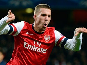 Half-Time Report: Arsenal cruising through Podolski brace