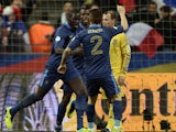 France's Mamadou Sakho celebrates with teammates after scoring the opening goal against Ukraine during their World Cup play-off match on November 19, 2013
