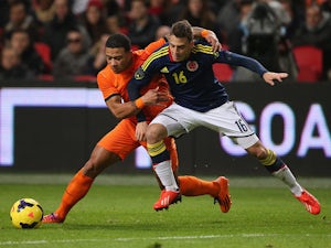 Colombia held by 10-man Holland