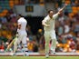 Australia 's Mitchell Johnson celebrates after dismissing England's Kevin Pietersen during day four of the First Ashes Test match on November 24, 2013