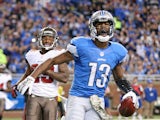 Nate Burleson of the Detroit Lions celebrates after scoring a touchdown on an 11 yard pass from quarterback Matthew Stafford during the game against the Tampa Bay Buccaneers on November 24, 2013