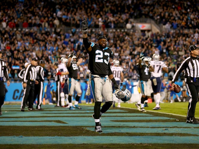 Melvin White #23 of the Carolina Panthers celebrates after the game is over against the New England Patriots at Bank of America Stadium on November 18, 2013
