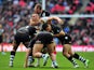 England's Sam Burgess is tackled by New Zealand's Elijah Taylor, Ben Matulino, Bryson Goodwin and Simon Mannering during the 2013 Rugby League World Cup semi-final match between England and New Zealand at Wembley Stadium in London, England on November 23,