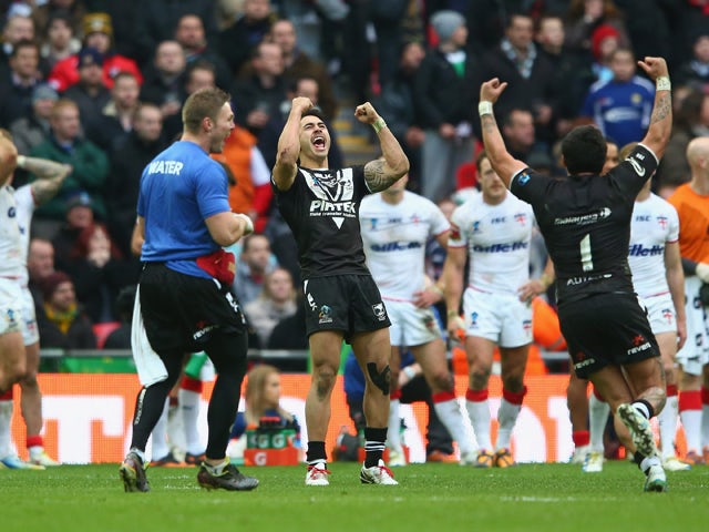 Shaun Johnson of New Zealand celebrates converting the winning try with the last kick of the game during the Rugby League World Cup Semi Final match between New Zealand and England at Wembley Stadium on November 23, 2013