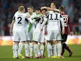 Wolfsburg's players celebrate after scoring the 0-1 during the German first division Bundesliga football match between FC Nuremberg vs VfL Wolfsburg in Nuremberg, southern Germany, on November 23, 2013