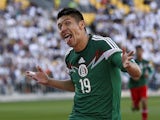 Oribe Peralta of Mexico celebrates a goal against New Zealand during their World Cup qualifying football match at Westpac Stadium in Wellington on November 20, 2013