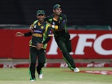 Pakistan captain Mohammad Hafeez and Ahmed Shehzad of Pakistan celebrate Pakistan beat South Africa to level the series 1-1 during the 2nd T20 International match between South Africa and Pakistan at Sahara Park Newlands on November 22, 2013