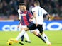 Panagiotis Kone midfielder of Bologna FC (L) fights for the ball with Argentinian midfielder Ricardo Gabriel Alvarez of Inter Milan (R) during their Serie A football match at the Renato Dall'Ara on November 24, 2013