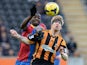 Paul McShane of Hull City tackled by Yannick Bolasie of Crystal Palace during the Barclays Premier League match between Hull City and Crystal Palace at KC Stadium on November 23, 2013
