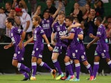 Michael Thwaite and Jamie Maclaren of the Glory celebrate a goal during the round seven A-League match between Perth Glory and the Central Coast Mariners at nib Stadium on November 23, 2013