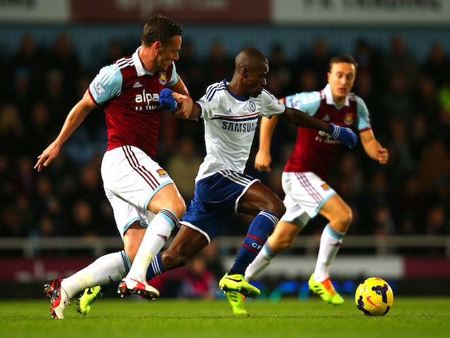 Ramires of Chelsea and Kevin Nolan of West Ham compete for the ball during the Barclays Premier League match on November 23, 2013
