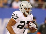 Rashad Jennings of the Oakland Raiders in action against the New York Giants during their game at MetLife Stadium on November 10, 2013