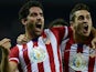 Atletico Madrid's Raul Garcia celebrates with Koke after scoring during the Spanish League football match against Getafe on November 23, 2013