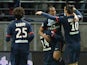 Paris Saint-Germain's Brazilian forward Lucas Moura is congratulated by his teammates after scoring a goal during the French Football match Reims vs Paris Saint-Germain, on November 23, 2013