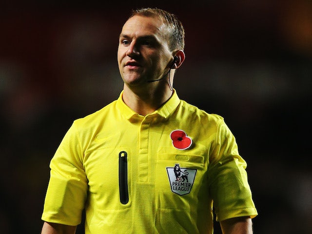 Match referee Robert Madley looks on during the Barclays Premier League match between Swansea City and Stoke City at Liberty Stadium on November 10, 2013