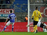 Bastia's Franco Algerian midfielder Ryad Boudebouz scores a goal past Sochaux goalkeeper Simon Pouplin on November 23, 2013