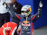German Formula One driver Sebastian Vettel celebrates his victory in the Brazil F-1 GP on November 24, 2013 