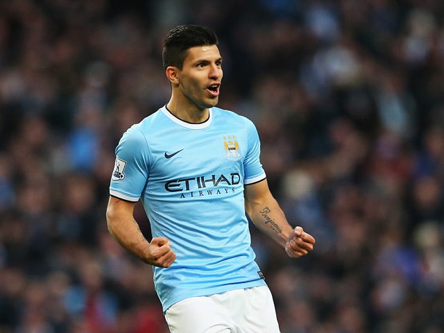 Man City's Sergio Aguero celebrates after scoring his team's fourth goal and his second of the match against Tottenham on November 24, 2013