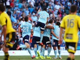 Sydney FC celebrate a goal by Richard Garcia during the round seven A-League match between Sydney FC and the Wellington Phoenix at Allianz Stadium on November 23, 2013
