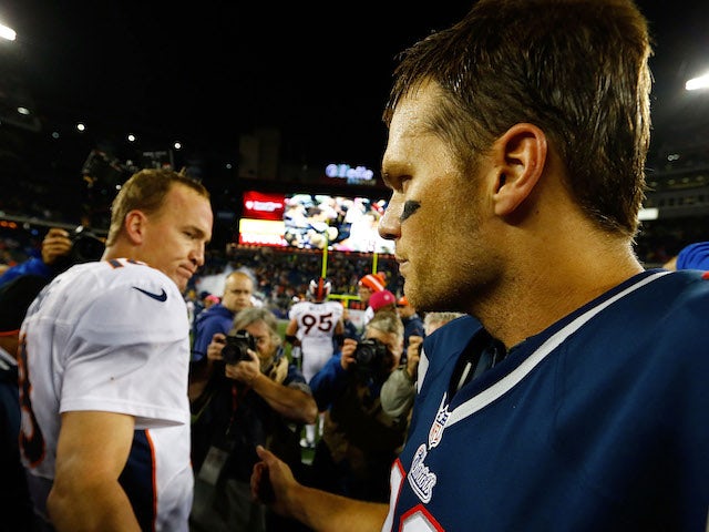 Tom Brady of the New England Patriots and Peyton Manning of the Denver Broncos greet each other at midfield following a game on October 7, 2012