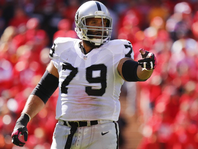 Tony Pashos of the Oakland Raiders looks to the sideline for a call before the next play against the Kansas City Chiefs in the first quarter October 13, 2013