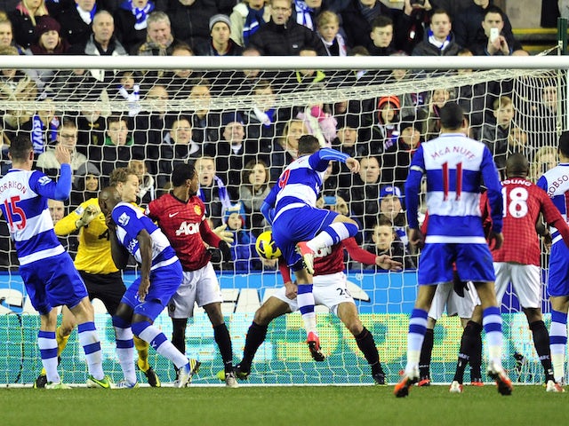 Reading's English striker Adam Le Fondre scores their second goal during the English Premier League football match between Reading and Manchester United on December 1, 2012