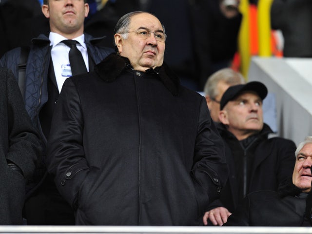 Arsenal's Russian shareholder Alisher Usmanov looks on before the English Premier League football match between Tottenham Hotspur and Arsenal at White Hart Lane in north London on March 3, 2013