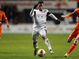 Swansea City's Spanish striker Alvaro Vazquez vies for the ball against Valencia during the Group A Europa League football match between Swansea and Valencia CF at The Liberty Stadium in Swansea on November 28, 2013