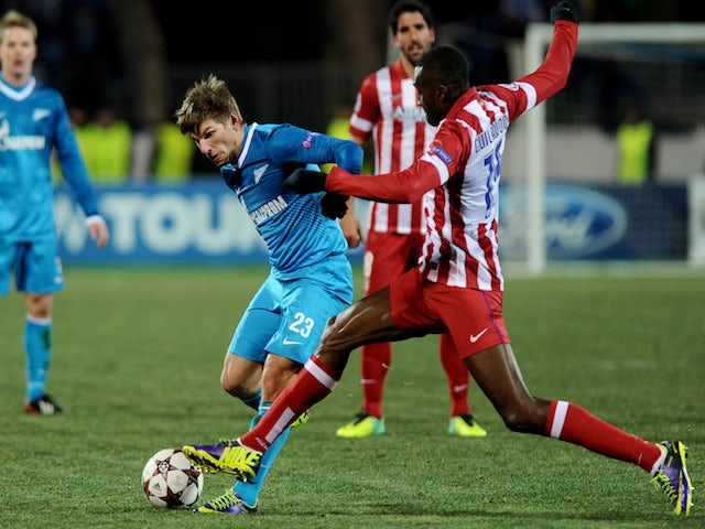 Zenit Saint-Petersburg's Andrey Arshavin vies with Atletico Madrid's Miranda during their UEFA Champions League group G match in Saint-Petersburg on November 26, 2013