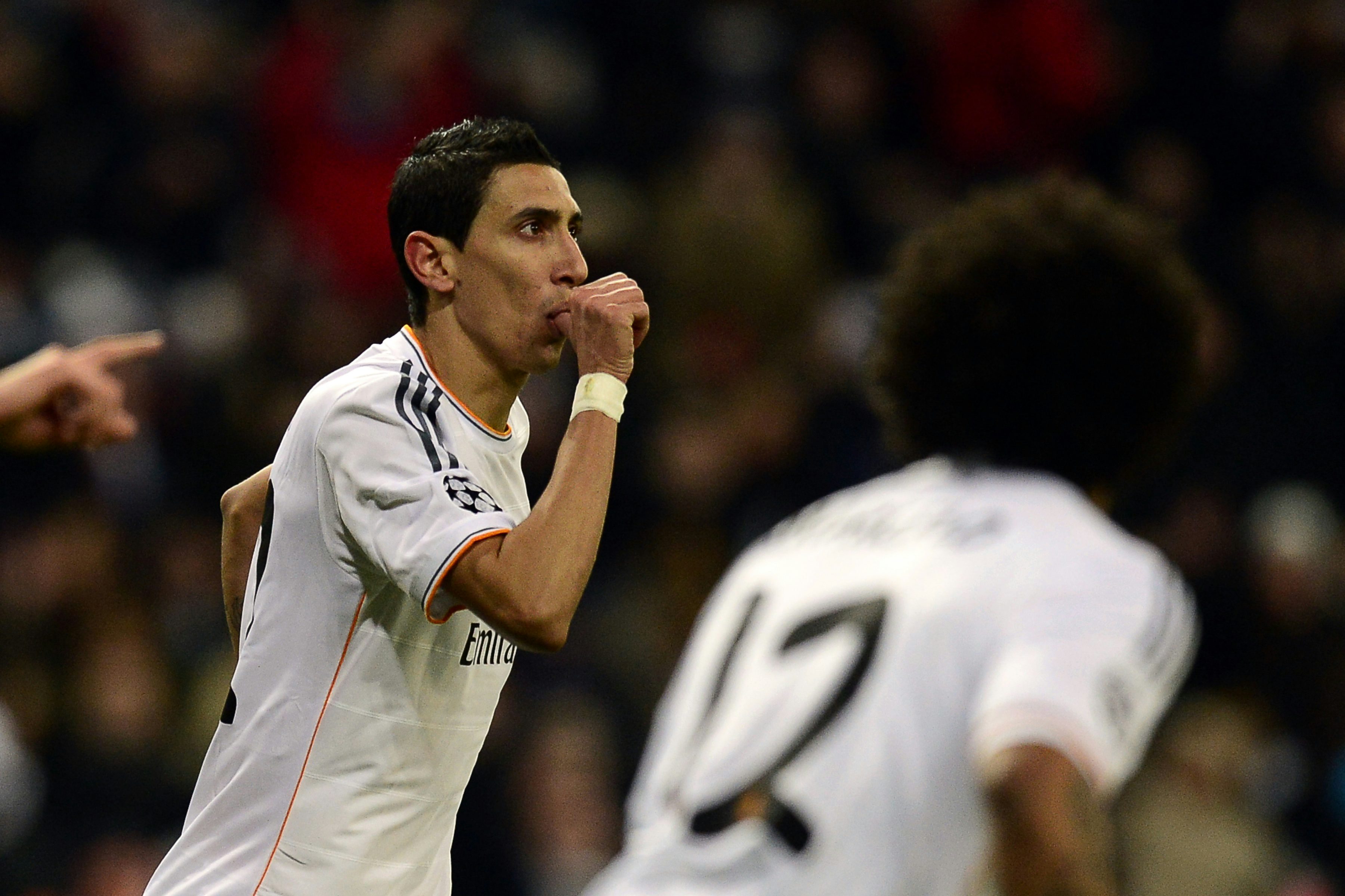 Real Madrid' Angel di Maria celebrates after scoring his team's third goal against Galatasaray during their Champions League group match on November 27, 2013