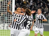 Juventus' Arturo Vidal is congratulated by teammates after scoring the opening goal against Copenhagen during their Champions League group match on November 27, 2013