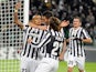 Juventus' Arturo Vidal is congratulated by teammates after scoring the opening goal against Copenhagen during their Champions League group match on November 27, 2013