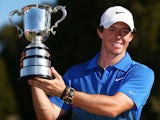 Rory McIlroy of Northern Ireland holds aloft the Australian Open trophy after victory during day four of the 2013 Australian Open at Royal Sydney Golf Club on December 1, 2013
