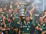 Cameron Smith the captain of Australia lifts the winners trophy after his sides 34-2 victory during the Rugby League World Cup Final between Australia and New Zealand on November 30, 2013
