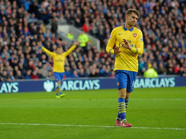 Aaron Ramsey of Arsenal doesn't celebrate scoring their first goal in respect for Cardiff his old team during the Barclays Premier League match between Cardiff City and Arsenal at Cardiff City Stadium on November 30, 2013