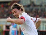 Riccardo Montolivo of Milan celebrates after scoring his team's equalizing goal during the Serie A match between Calcio Catania and AC Milan at Stadio Angelo Massimino on December 1, 2013