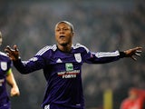 Anderlecht's Chancel Mbemba celebrates after scoring the opening goal against Benfica during their Champions League group match on November 27, 2013