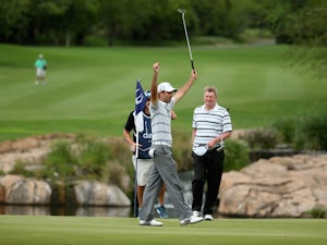 Charl Schwartzel of South Africa celebrates winning the Alfred Dunhill Championship on a score of -17 under par at Leopard Creek Country Club on December 1, 2013