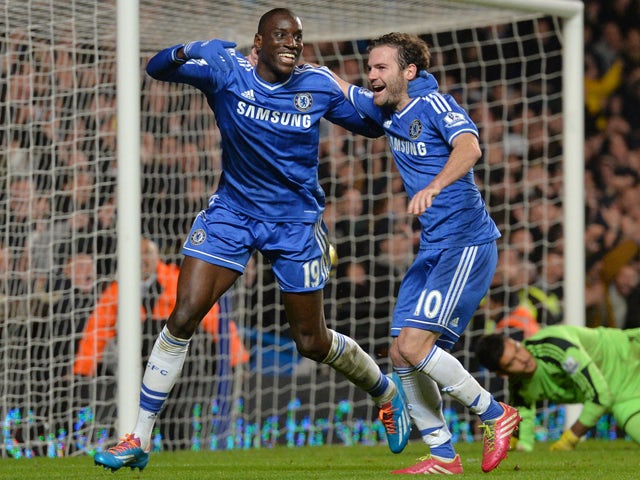 Chelsea's French-born Senegalese striker Demba Ba celebrates with Chelsea's Spanish midfielder Juan Mata after Ba scored Chelsea's third goal during the English Premier League football match between Chelsea and Southampton at Stamford Bridge in London, on