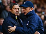 Chris Hughton the Norwich manager greets Tony Pulis the Crystal Palace manager prior to kickoff during the Barclays Premier league match between their two sides on November 30, 2013