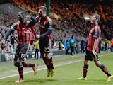 Cristian Zapata of AC Milan celebrates after scoring with Antonio Nocerino during the UEFA Champions League Group H match against Celtic on November 26, 2013