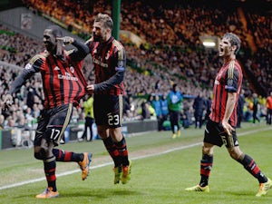 Cristian Zapata of AC Milan celebrates after scoring with Antonio Nocerino during the UEFA Champions League Group H match against Celtic on November 26, 2013