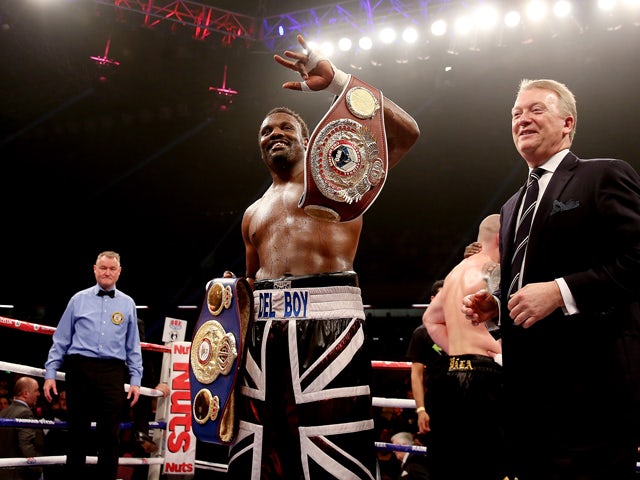 Dereck Chisora celebrates his victory over Ondrej Pala during their WBO and Vacant International Heavyweight Championship bout at The Copper Box on November 30, 2013