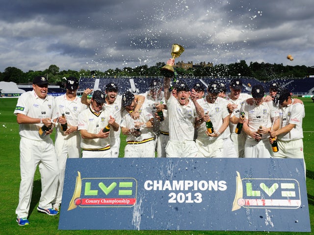 Durham captain Paul Collingwood and team celebrate with the trophy after winning the LV County Championship Division One title after day three of the LV County Championship Division One match between Durham and Nottinghamshire at The Riverside on Septembe