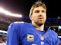 Eli Manning of the New York Giants walks off the field after the loss to the Dallas Cowboys at MetLife Stadium on November 24, 2013