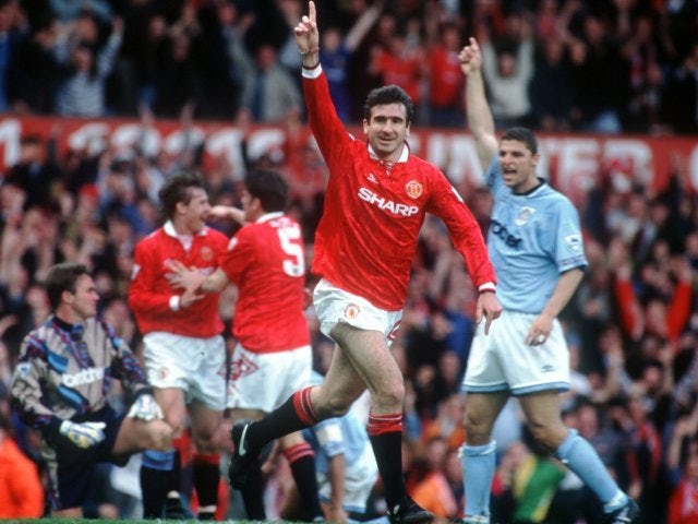 Eric Cantona celebrates scoring against Manchester City on April 23, 1994.